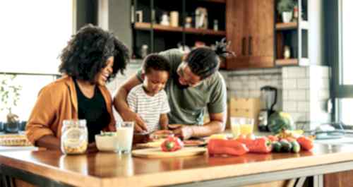 Parents and kid cooking in the kitchen